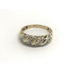 A 9carat gold ring set with a pattern of diamonds