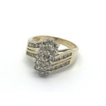 A 14 carat gold ring set with an unusual triple cl