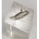 An 18ct white gold solitaire diamond ring with gra