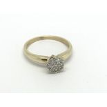 A 9carat gold ring set with a pattern of diamonds