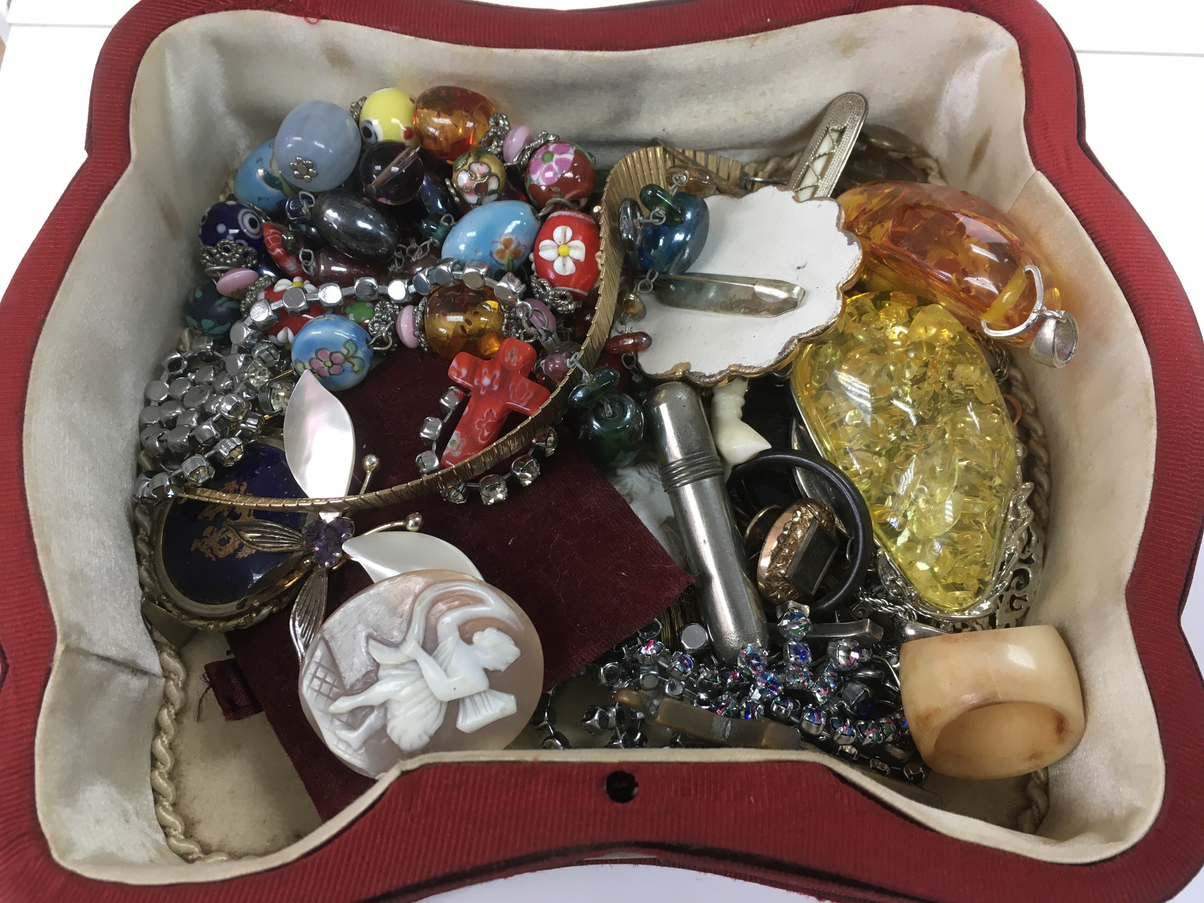 A jewellery box containing a small collection of c