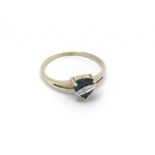 A 9ct gold ring set with a heart shaped sapphire a