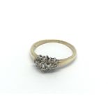 A 9carat gold ring set with a pattern of baguette