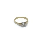 A 9carat gold ring set with a solitaire diamond. r
