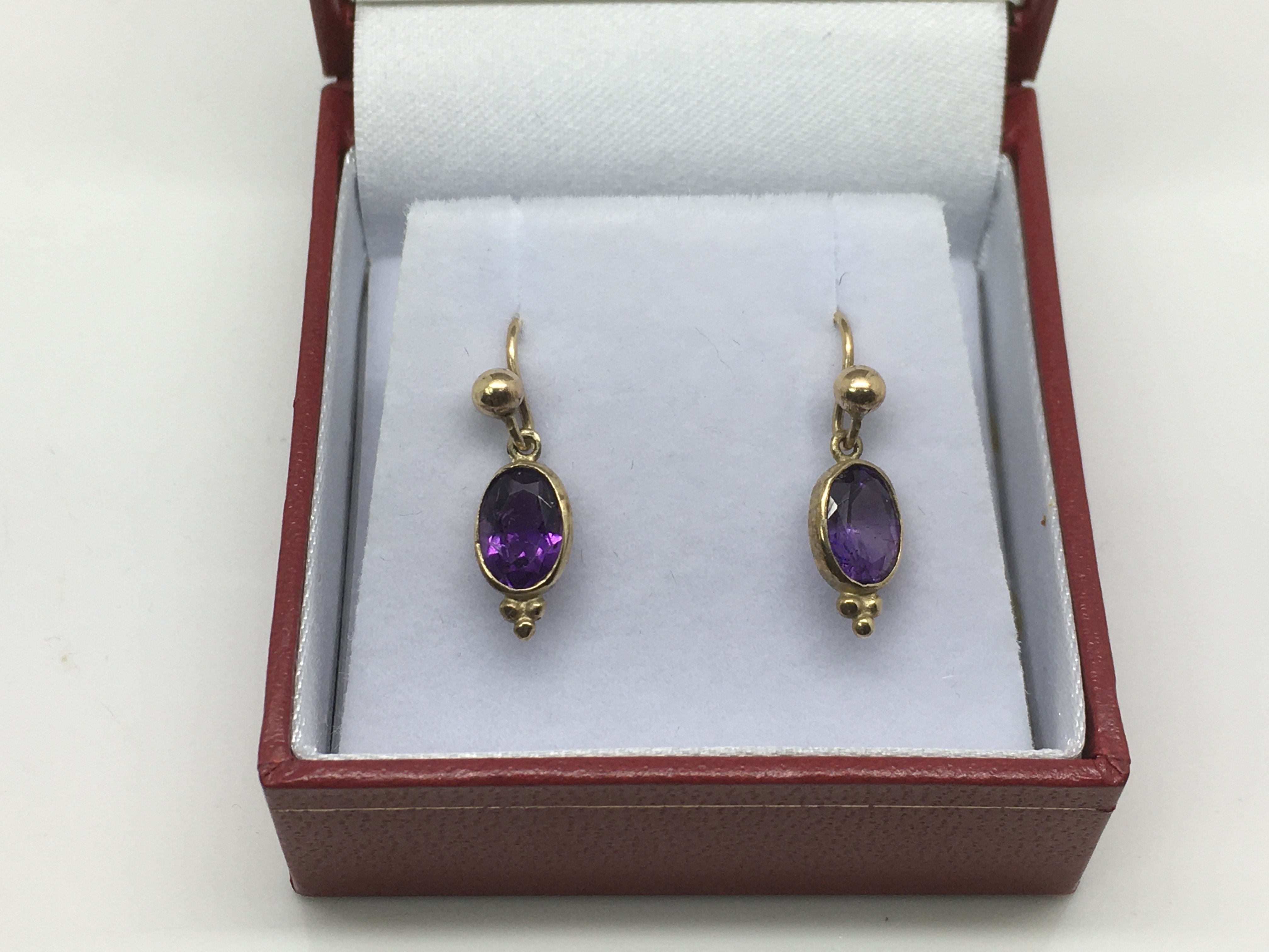 A pair of 9ct gold drop earrings set with amethyst, approx 1g.