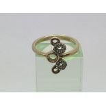 A 9ct gold ring with circular pattern design, appr