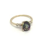 A 9carat gold ring set with a mystic Topaz and sma