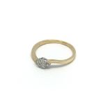 An 18carat gold ring set with a pattern of six dia