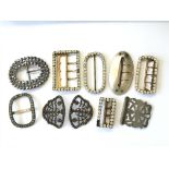 A collection of eight antique paste buckles includ