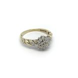 A 9carat yellow gold ring set with a pattern of di