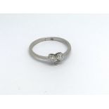 An 18ct gold and diamond 3 stone heart ring. (M),