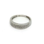 A 9carat white gold ring set with a pattern of dia