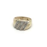 An 110 carat gold ring set with rows of diamonds r