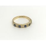 An 18carat gold ring set with alternating blue sap