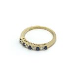 An 18carat gold ring set with alternating diamonds