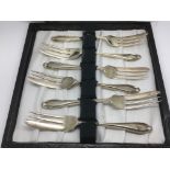 A cased set of six silver cake forks, London hallm