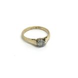 An 18carat gold ring set with a solitaire diamond