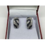 A pair of 18ct white gold earrings set with diamonds and sapphires, approx 7g.