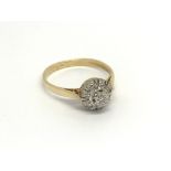 An 18carat gold ring set with a pattern of diamond