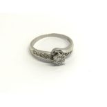 A 9carat white gold ring set with a solitaire diam