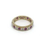 A 9carat gold eternity ring set with alternating r