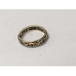 A gold ring set with alternating Rubys and small d