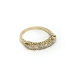 An 18ct gold seven stone diamond ring, approx .33c