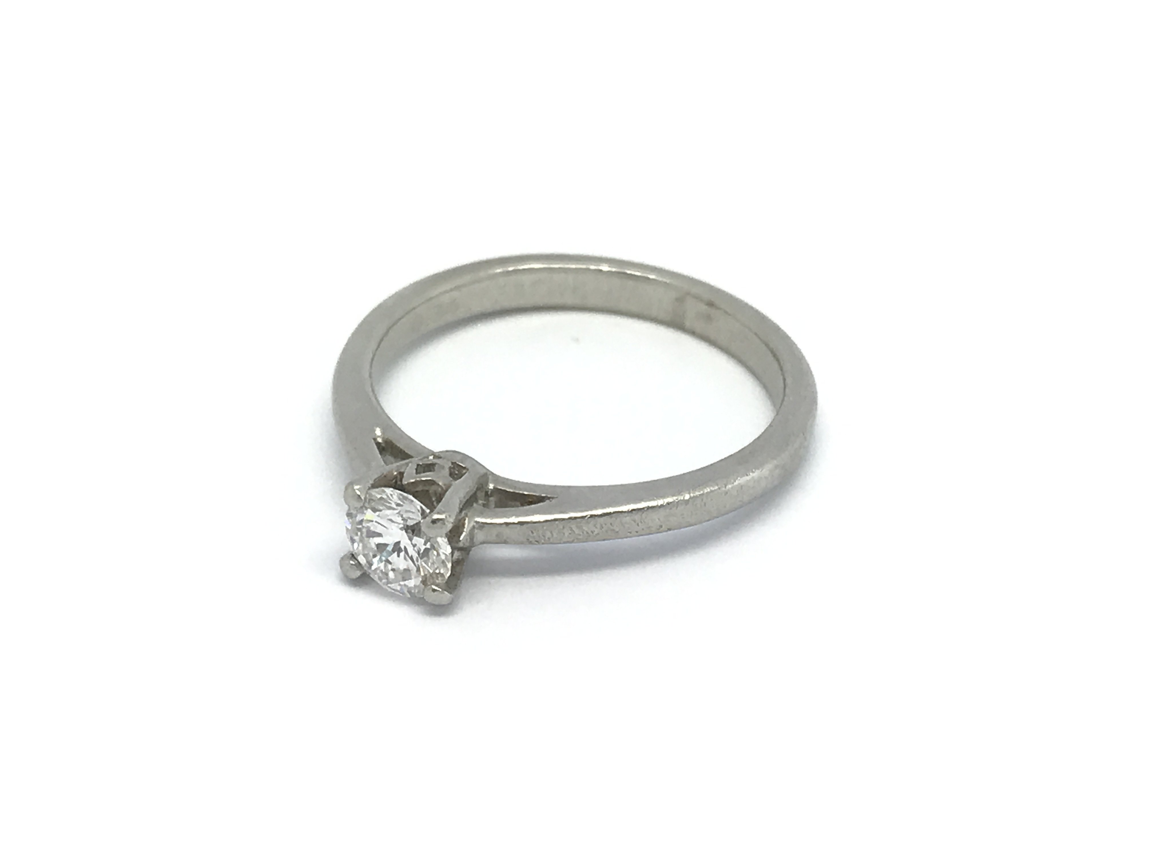 An 18carat white gold ring set with a solitaire di