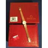 A ladies omega gold tone wristwatch, boxed.