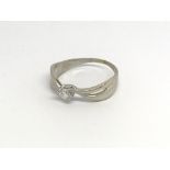 An 18carat white gold ring set with a brilliant cu