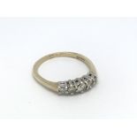 A 9ct gold five stone diamond ring, approx .25ct,