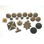 A small collection of military badges and buttons