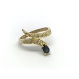 An Indian influence 18carat gold ring set with a sapphire and diamonds. ring size L.