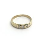 A 9carat gold ring set with five diamonds. ring si