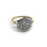 A 9carat gold ring set with a pattern of sapphire