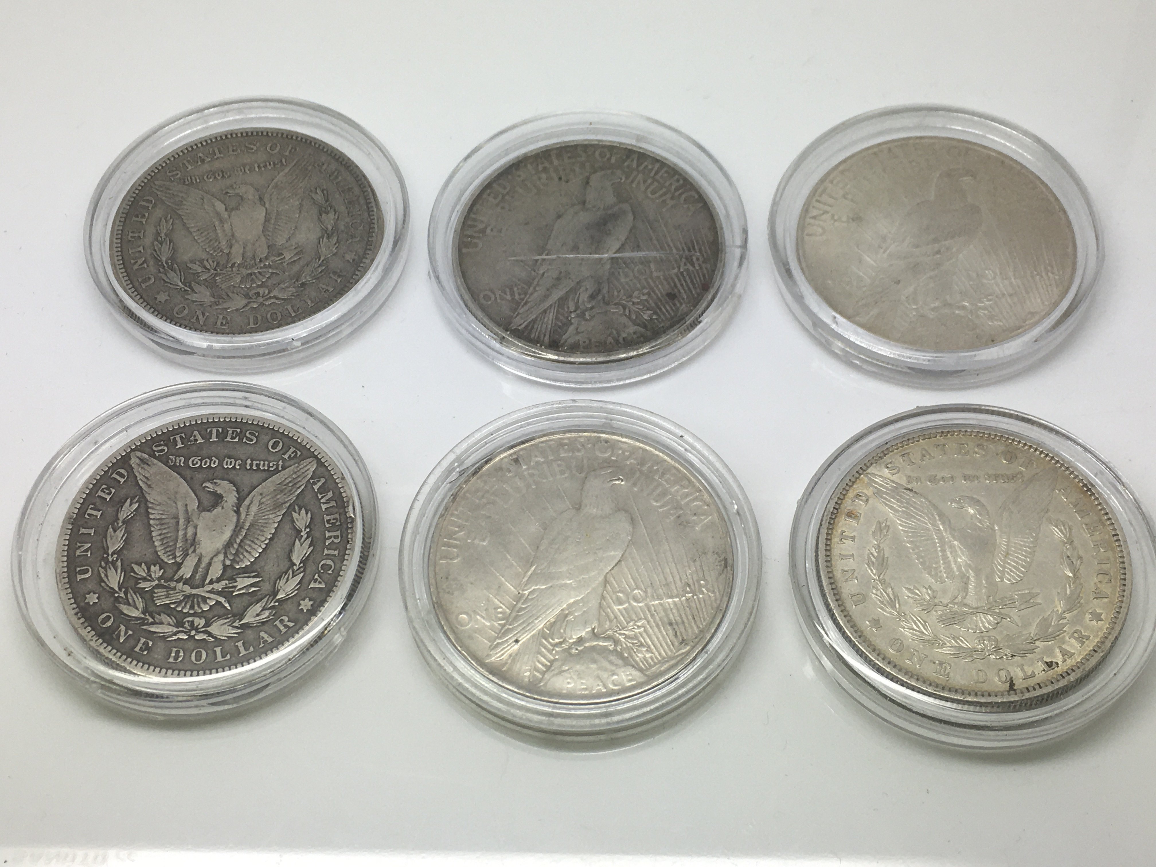 Six silver US dollars.