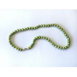 A green cultured pearl necklace having sterling si