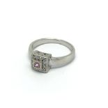 A 14 carat white gold ring set with a pink sapphir