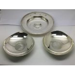 A silver Armada dish and a pair of white metal (te