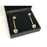 A pair of 9ct gold earrings in the form of balls