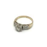 A 10carat gold ring sei with a pattern of diamonds