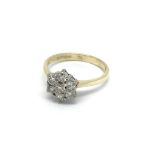 An 18carat gold diamond cluster ring. Size K.