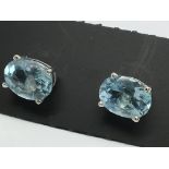 A pair of blue topaz studs in silver