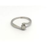 A 9carat white gold ring set with a solitaire diam