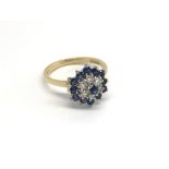 An 18carat gold ring set with sapphire and diamond