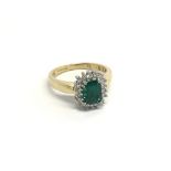 An 18carat gold ring set with a good size green to