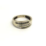 A 9carat gold ring set with three stepped rows of