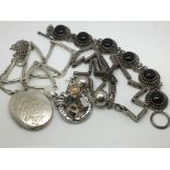 A bag of silver jewellery items.