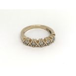 A 9carat gold ring set with a row of five diamonds. ring size N