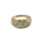 A 9carat gold ring set with a pattern of diamonds